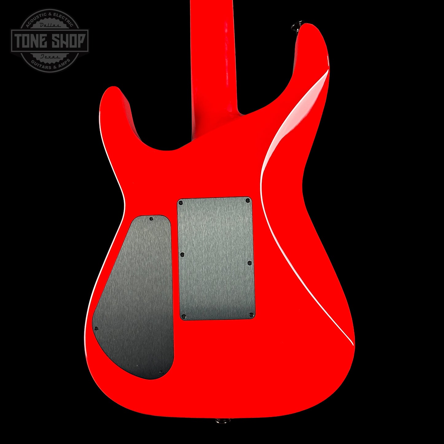 Red electric guitar body with a black pickguard on a black background, featuring 'Tone Shop' logo.