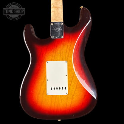 Electric guitar with a sunburst finish on a black background, featuring the Fender logo.