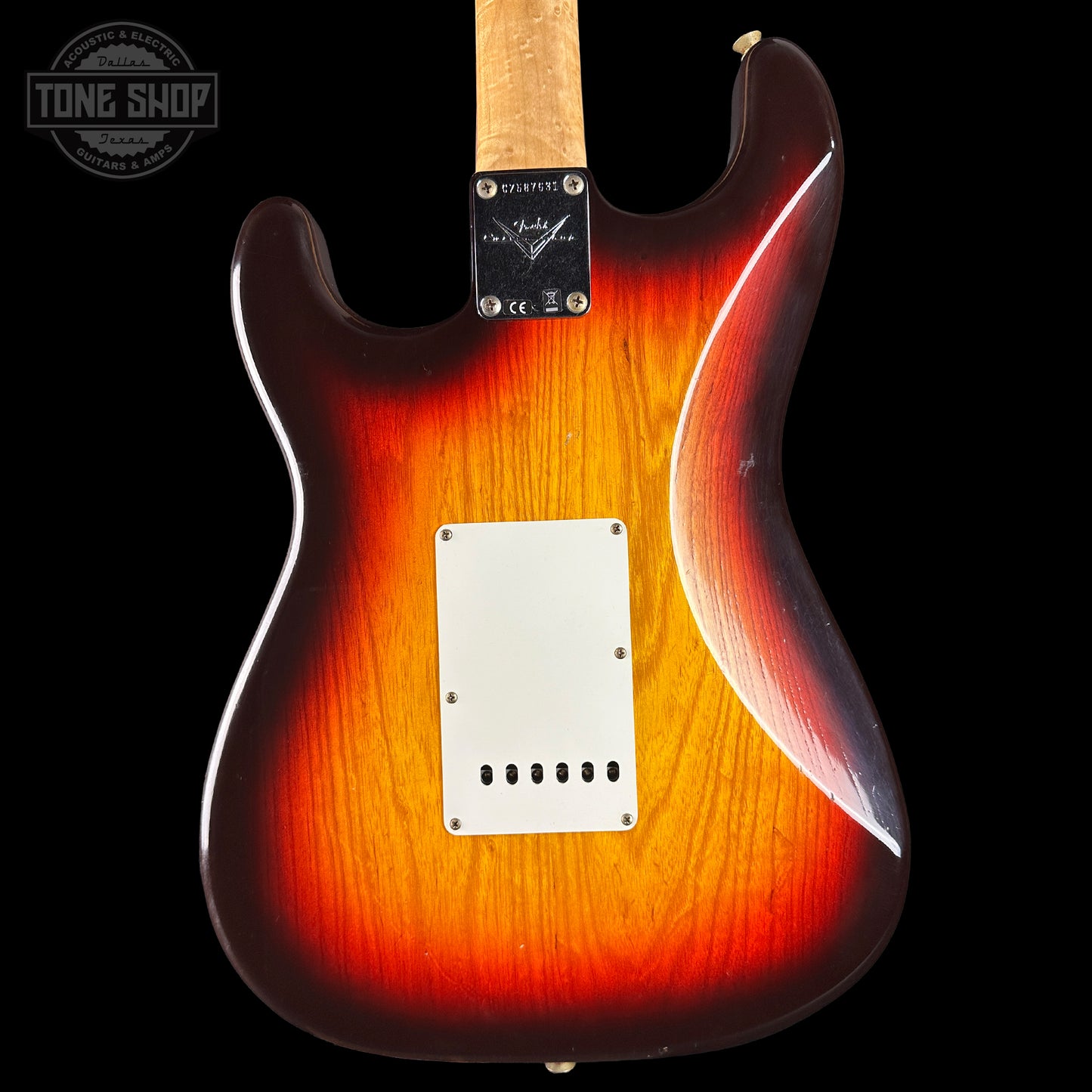 Fender electric guitar with a sunburst finish on a black background, featuring the Tone Shop logo.