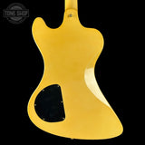 Yellow electric guitar body on a black background with 'Tone Shop' logo.