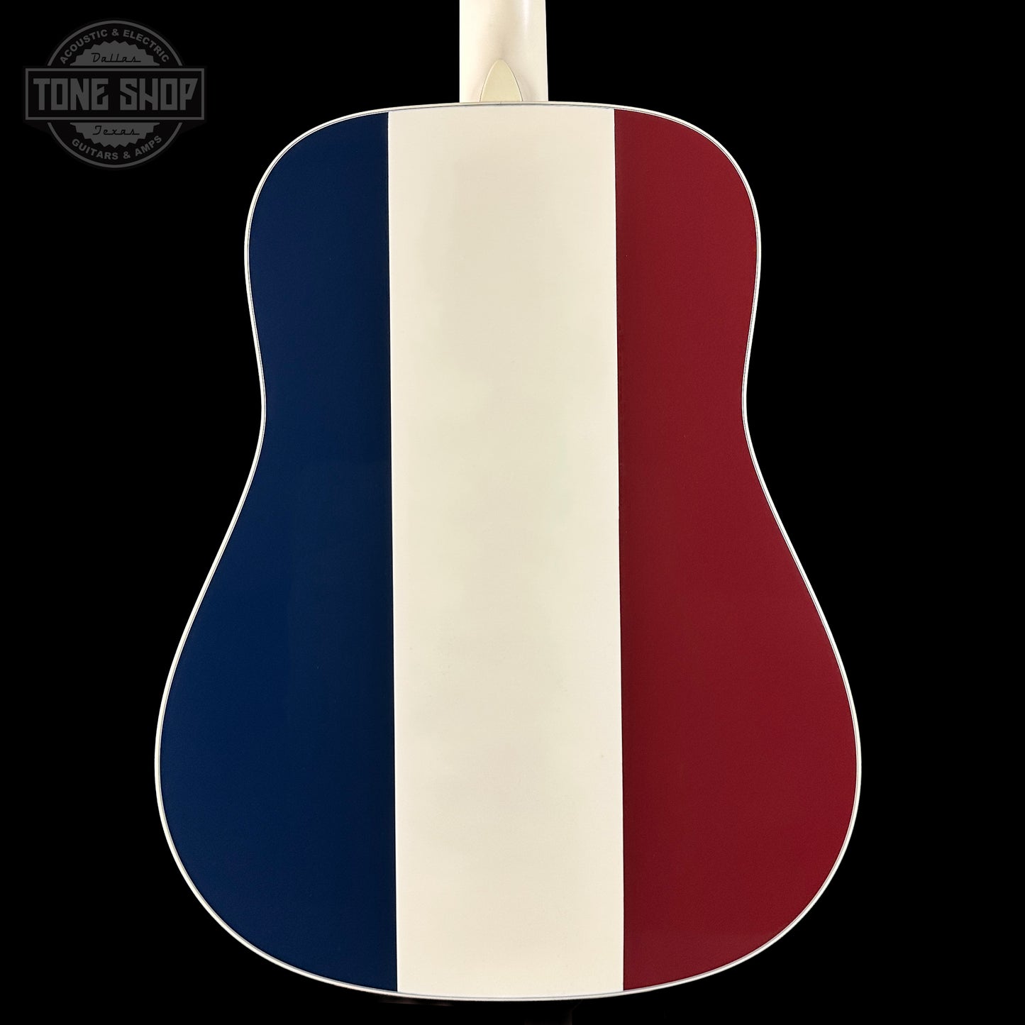 Acoustic guitar with a design featuring blue, white, and red stripes on a black background.