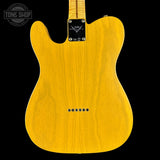 Yellow electric guitar body with brand logo on a black background