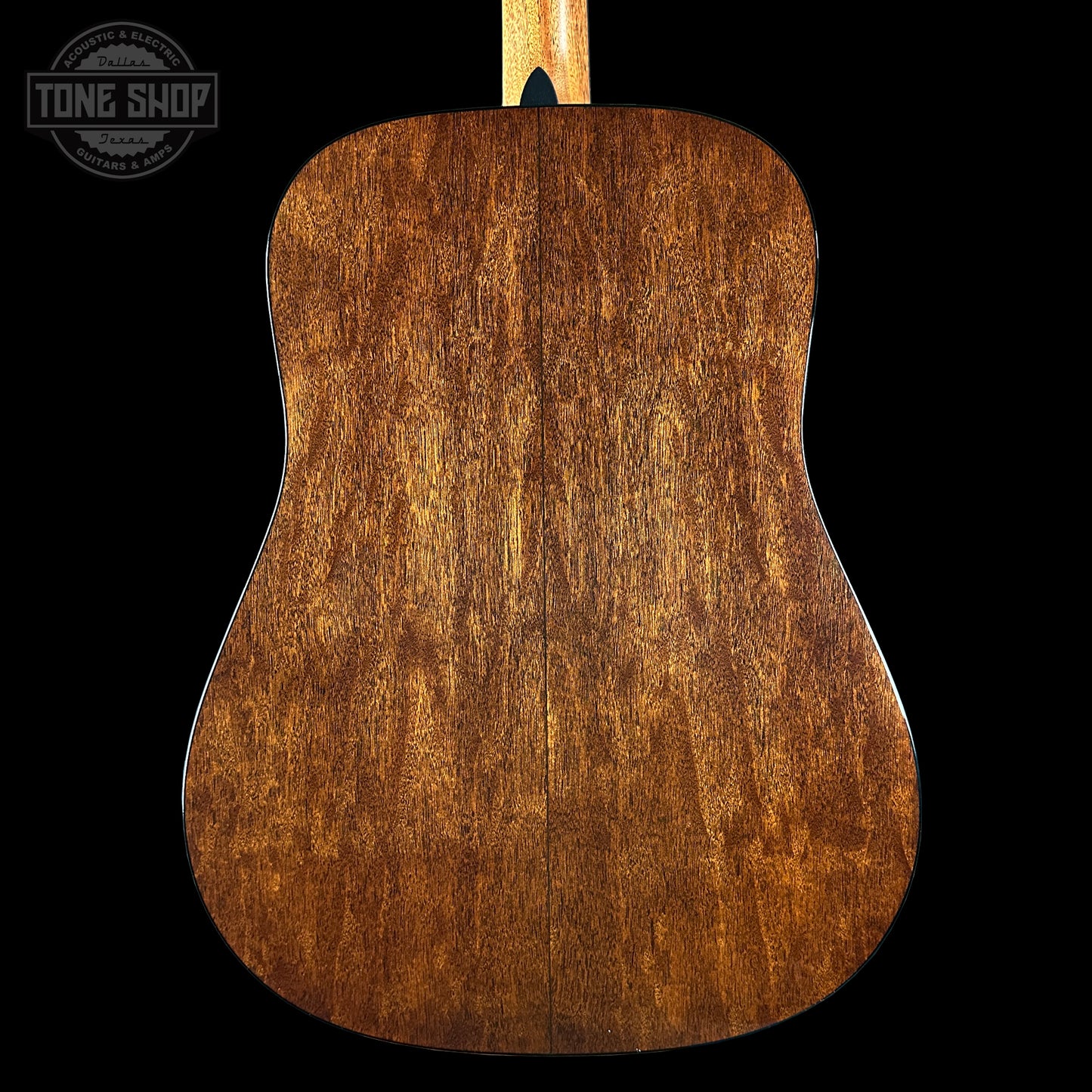 Back view of a wooden acoustic guitar 