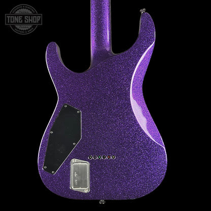 Purple glitter electric guitar body with 'Tone Shop' logo in the corner.