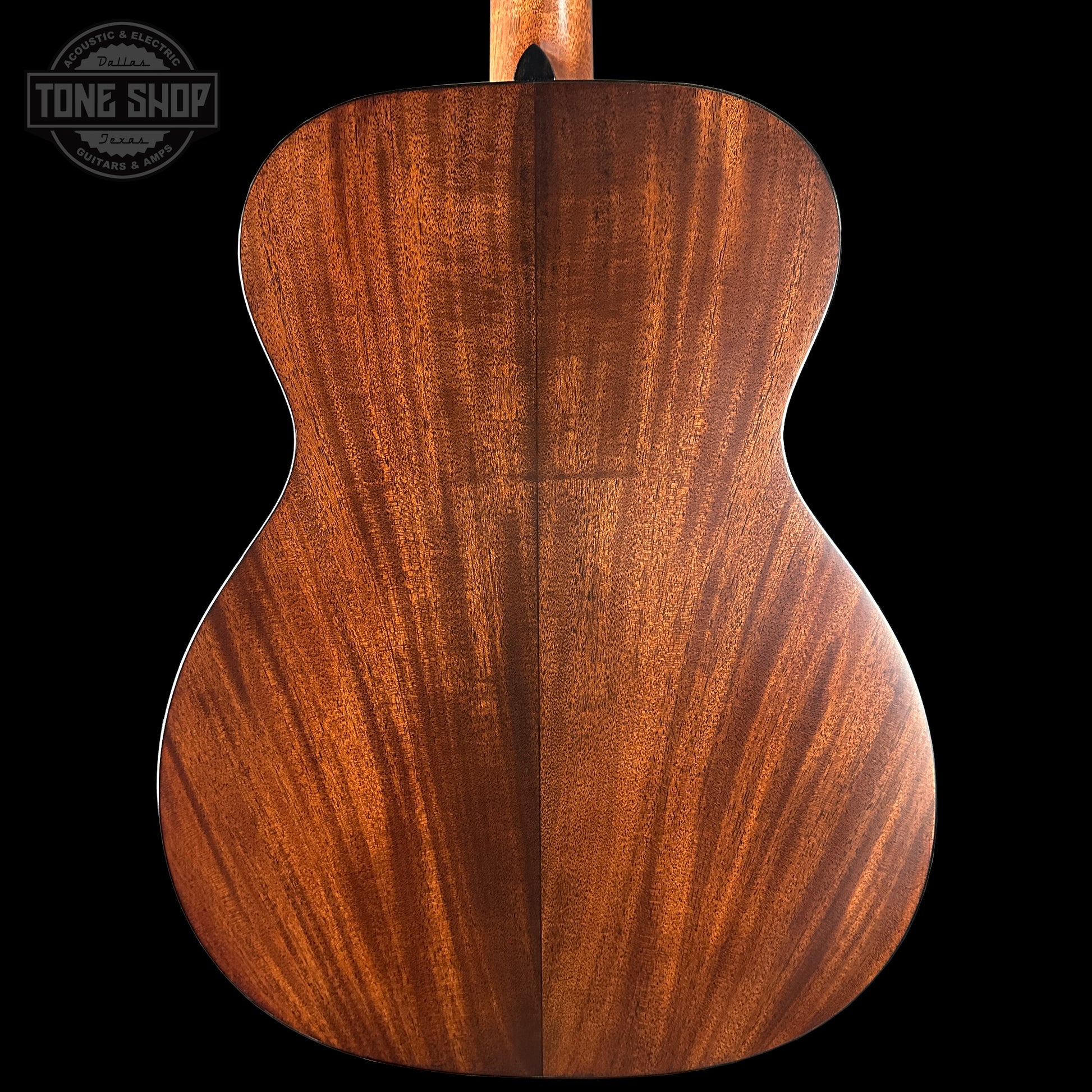 Wooden guitar back with a visible brand logo in the corner