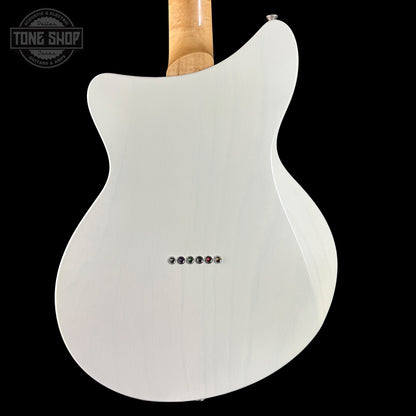 White electric guitar with a black background