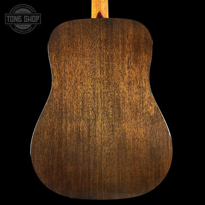 Back of a wooden acoustic guitar with 'Tone Shop' logo in the corner.