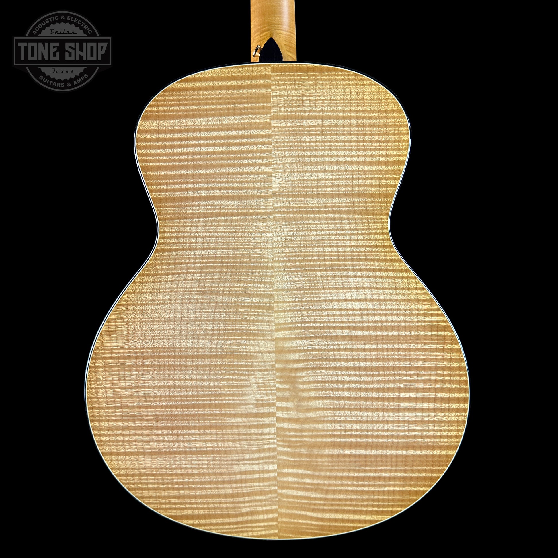 Back view of a guitar with a visible brand logo in the corner.