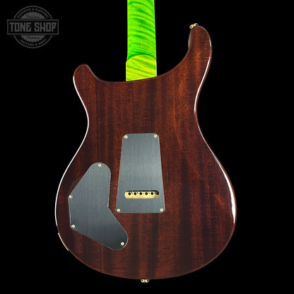 Back view of a wooden electric guitar with a green strap on a black background, featuring the Tone Shop logo.