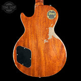 Back view of a Gibson electric guitar with a visible brand logo on a black background.