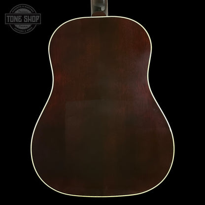 Back view of a wooden acoustic guitar with 'Tone Shop' logo.