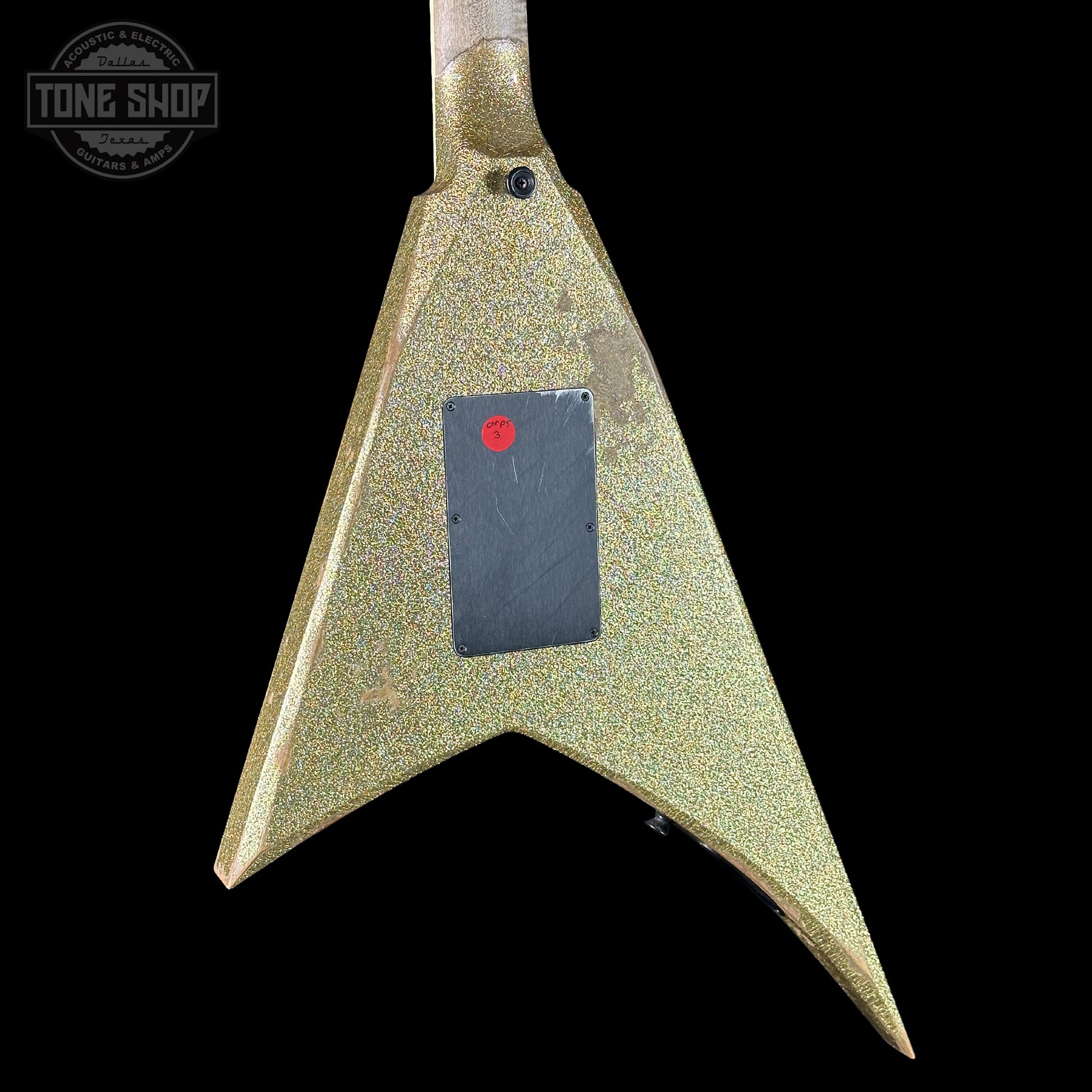 Guitar body with a textured finish and visible brand logo on a black background