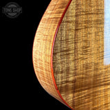 Back angle of Taylor 2025 Namm Custom #40 Grand Concert AA Koa.