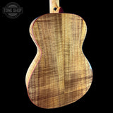 Back angle of Taylor 2025 Namm Custom #40 Grand Concert AA Koa.