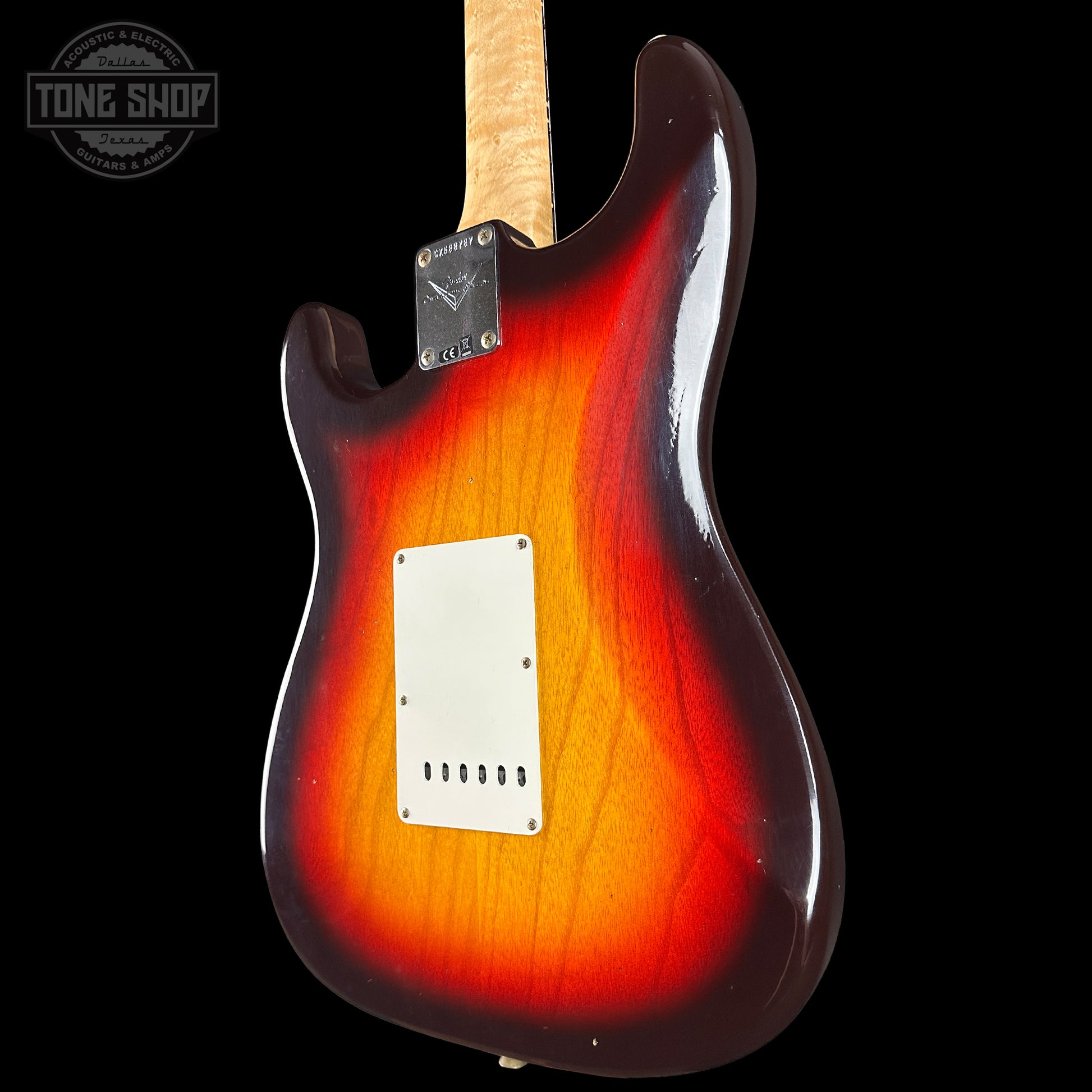 Electric guitar with a sunburst finish on a black background, featuring the Tone Shop logo.