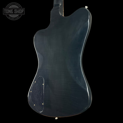 Back view of a blue electric guitar on a black background with 'Tone Shop' logo.