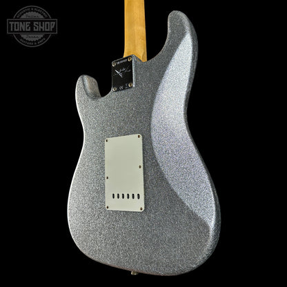 Silver glitter electric guitar body with a visible brand logo on a black background