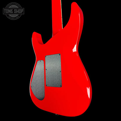 Red electric guitar on a black background with 'Tone Shop' logo.