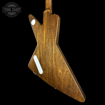 Wooden guitar body with a 'Tone Shop' logo in the corner