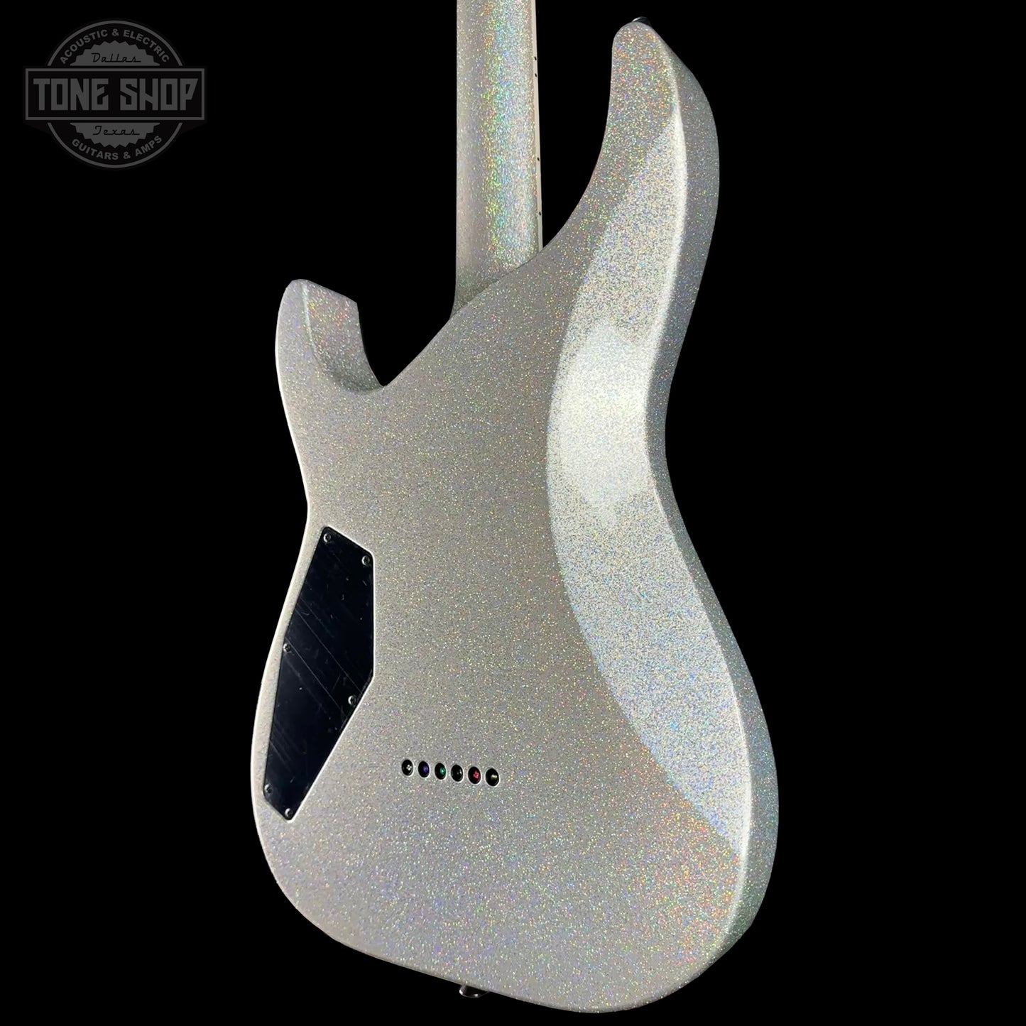 Silver electric guitar body with 'Tone Shop' logo in the corner