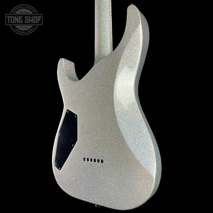 Silver electric guitar body with 'Tone Shop' logo in the corner