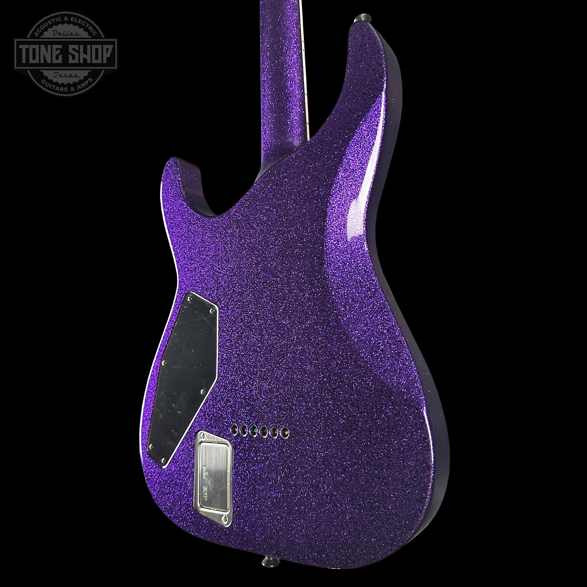Purple glitter electric guitar on a black background with 'Tone Shop' logo.