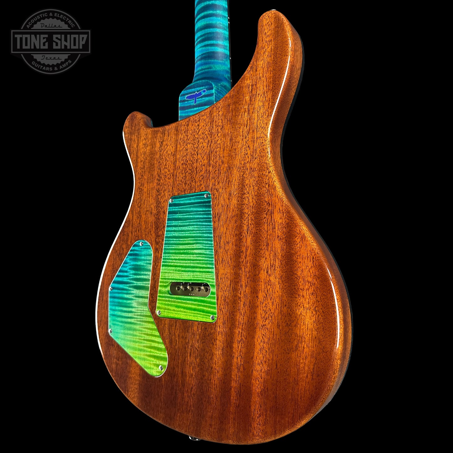 Wooden electric guitar with green and blue gradient on a black background, featuring 'Tone Shop' logo.