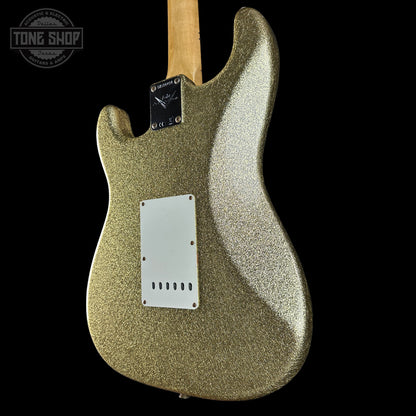Gold glittery electric guitar body on a black background with 'Tone Shop' logo.