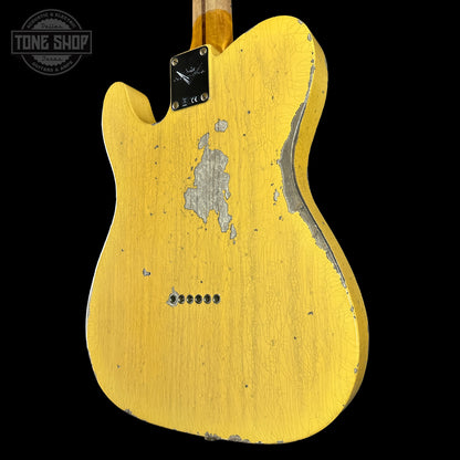 Yellow electric guitar back with 'Tone Shop' logo in the corner