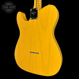 Yellow electric guitar body with 'Tone Shop' logo in the corner