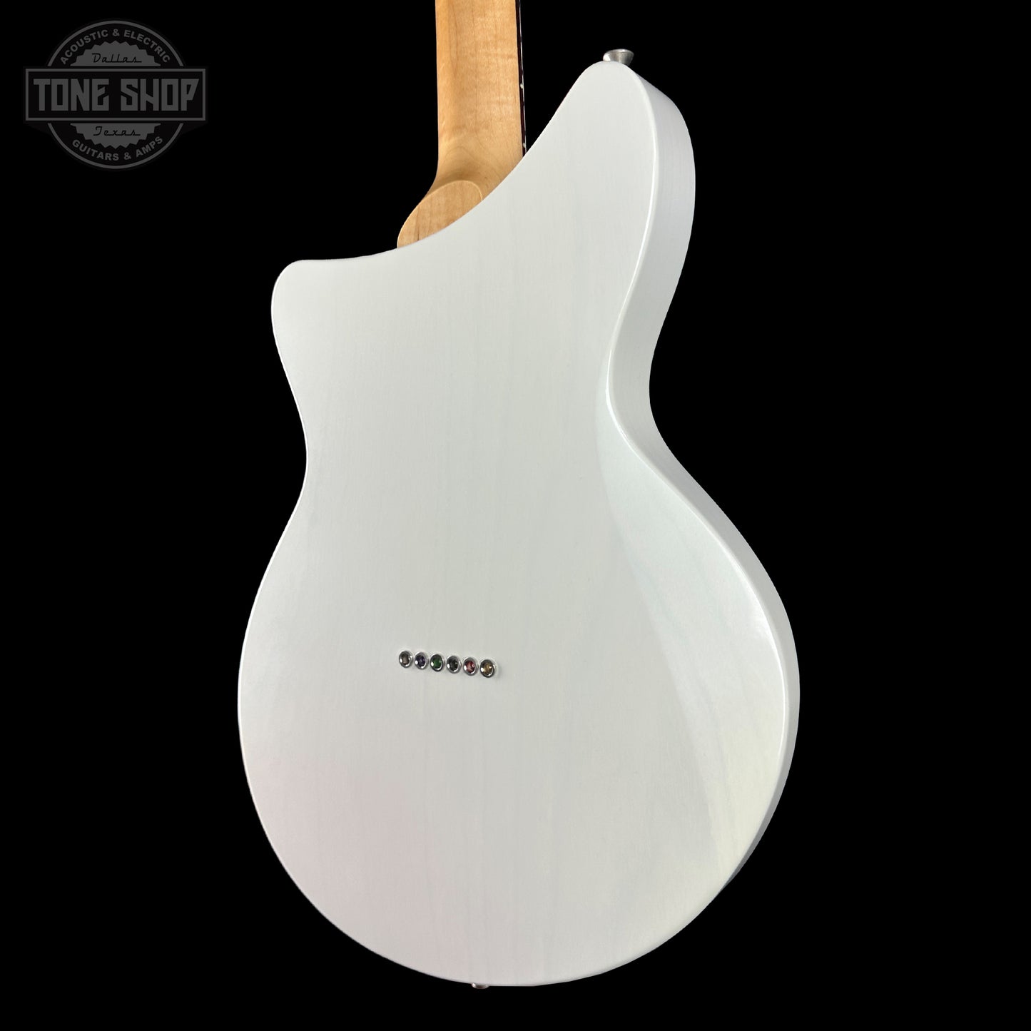 White electric guitar body with 'Tone Shop' logo in the corner