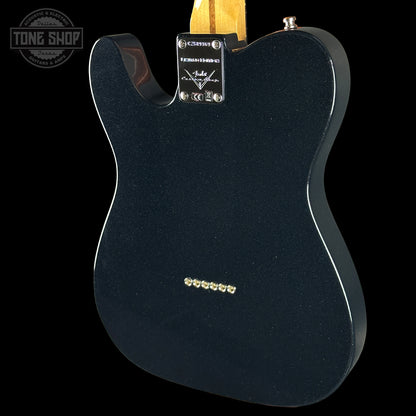 Black electric guitar body with visible brand logo on a white background