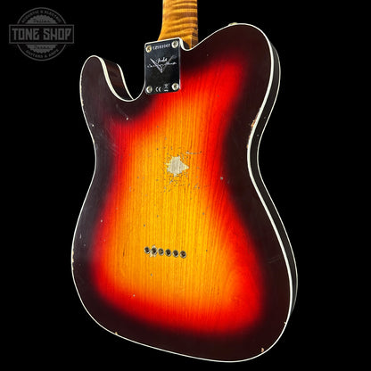 Guitar body with a sunburst finish on a black background, featuring the Tone Shop logo.