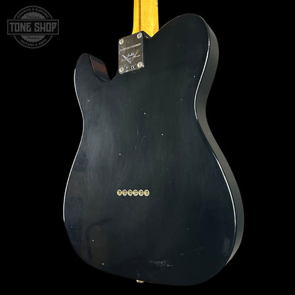 Black electric guitar body with 'Tone Shop' logo in the corner