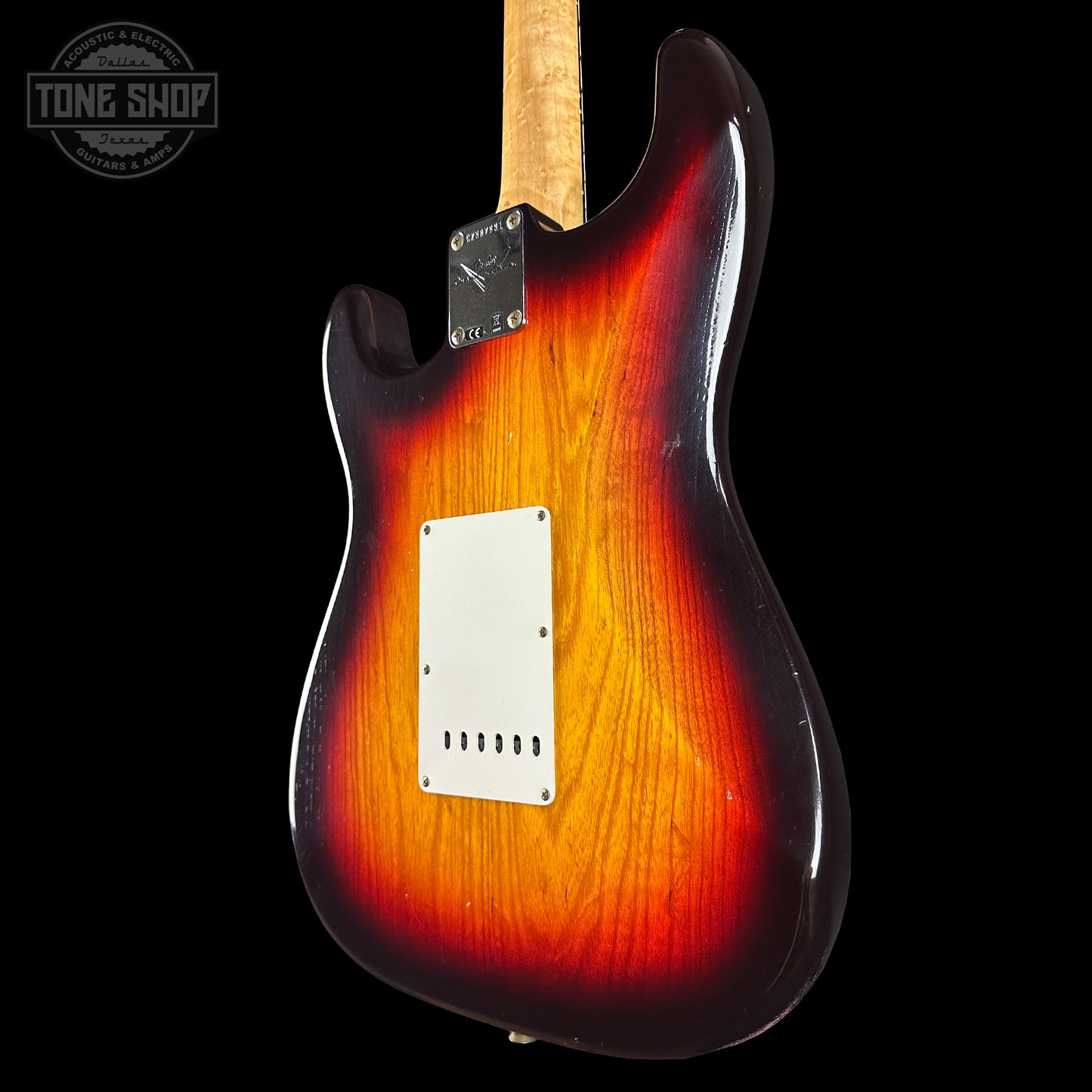 Electric guitar with a sunburst finish on a black background, featuring the Tone Shop logo.