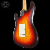 Electric guitar with a sunburst finish on a black background, featuring the Tone Shop logo.
