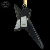 Black glitter electric guitar on a white background with 'Tone Shop' logo.