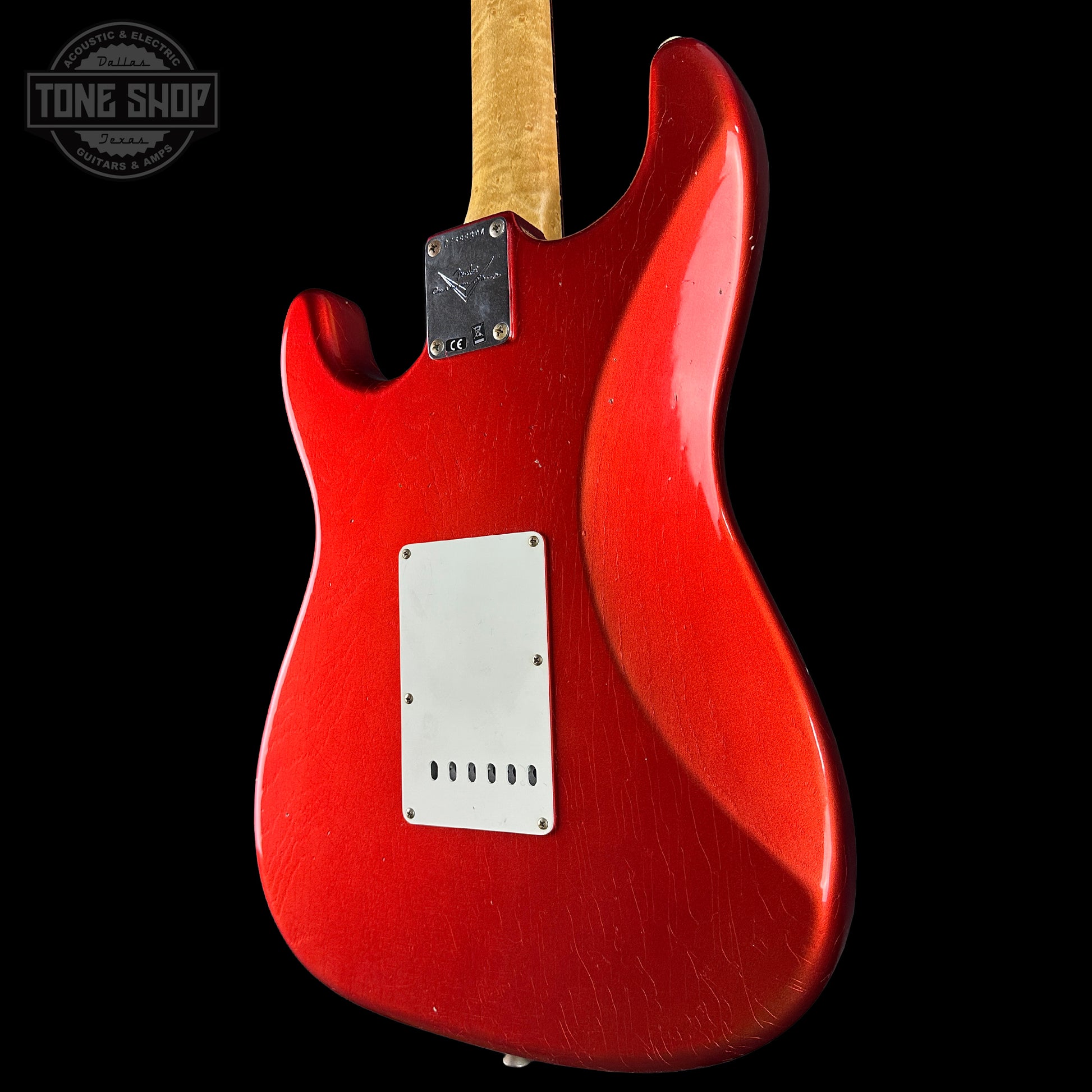Back angle of Fender Custom Shop 1963 Stratocaster Journeyman Relic AAA Maple Neck Melon Candy.