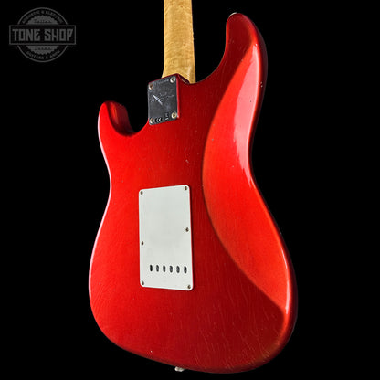 Back angle of Fender Custom Shop 1963 Stratocaster Journeyman Relic AAA Maple Neck Melon Candy.
