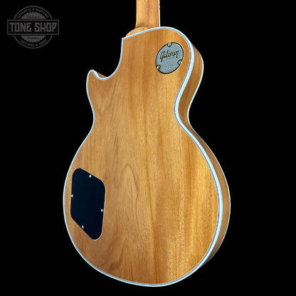 Wooden guitar body with Gibson logo on a black background