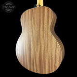 Wooden guitar body with 'Tone Shop' logo in the corner