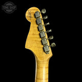Guitar headstock with tuning pegs on a black background, featuring the Tone Shop logo.
