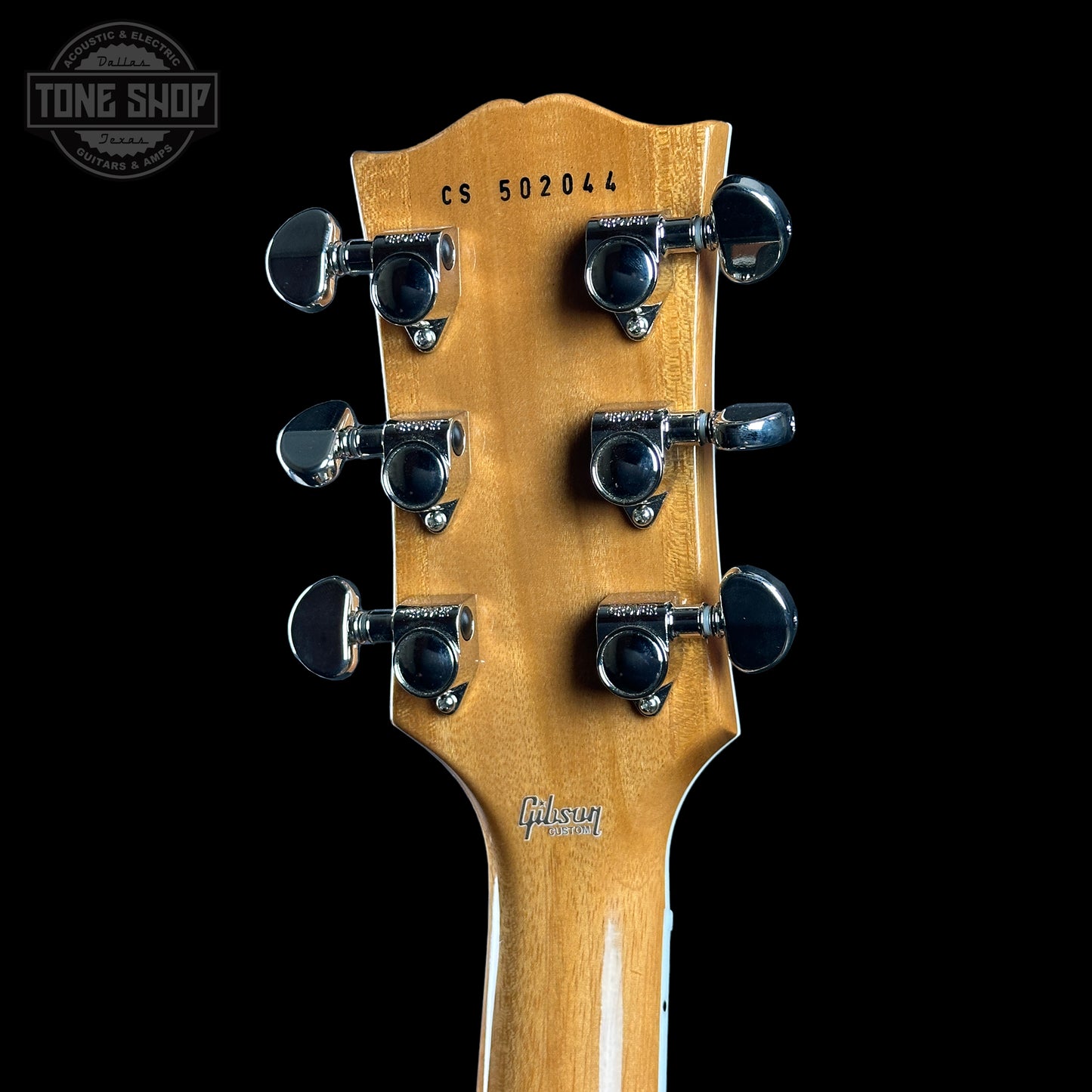 Back of headstock of Gibson Custom Shop TSG Anniversary Les Paul Custom Chambered 7A Quilt Cobra.