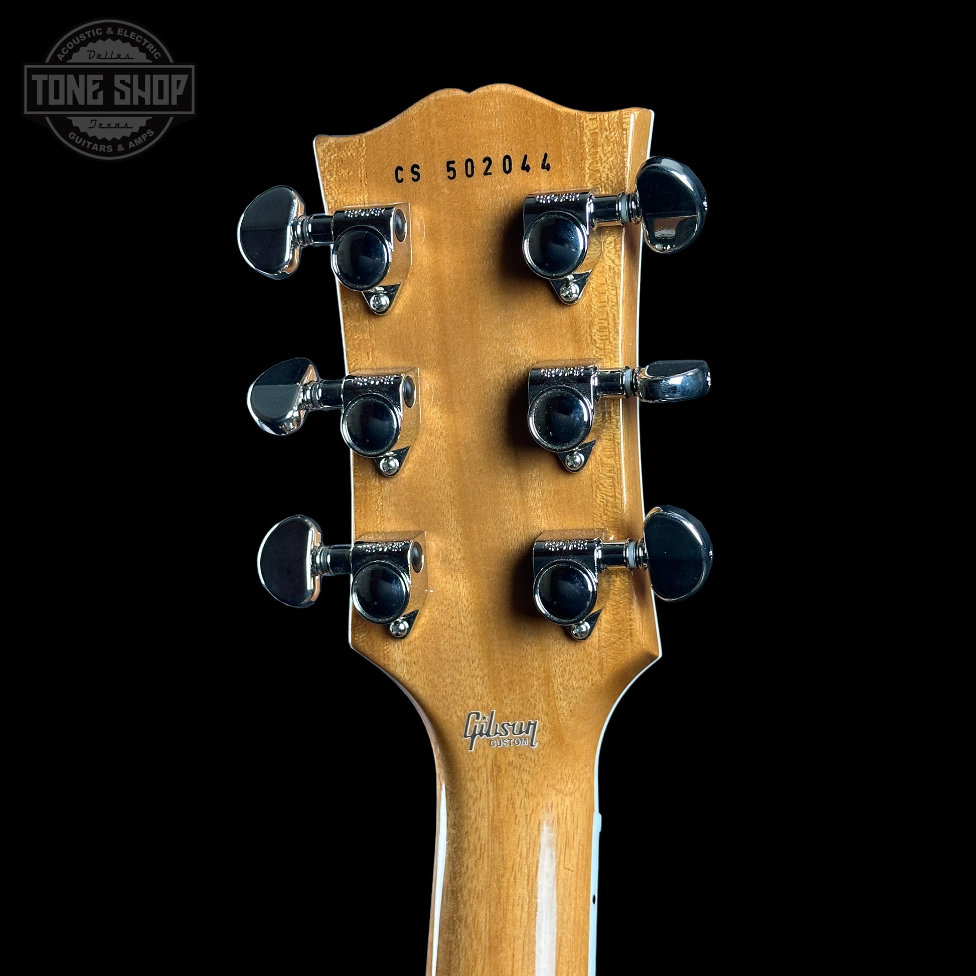 Back of headstock of Gibson Custom Shop TSG Anniversary Les Paul Custom Chambered 7A Quilt Cobra.