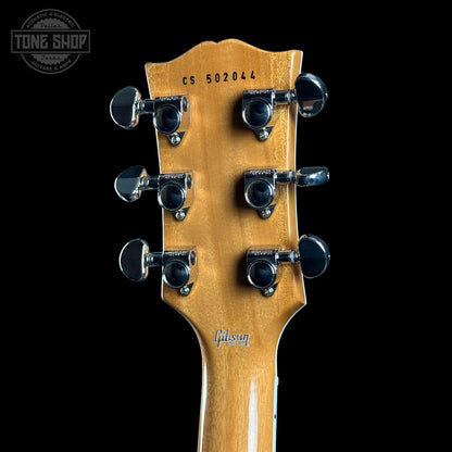 Back of headstock of Gibson Custom Shop TSG Anniversary Les Paul Custom Chambered 7A Quilt Cobra.