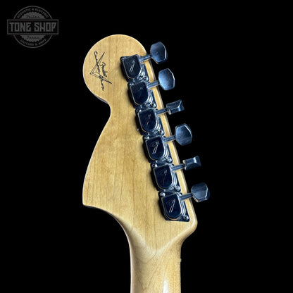 Guitar headstock with tuning pegs on a black background, featuring the Tone Shop logo.