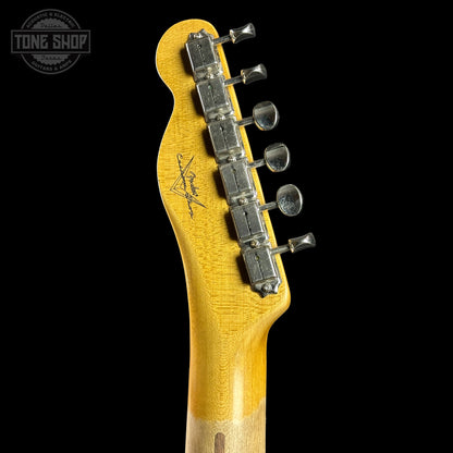 Guitar headstock with tuning pegs on a black background, featuring the Tone Shop logo.