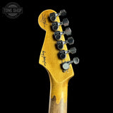 Guitar headstock with tuning pegs on a black background, featuring the Tone Shop logo.