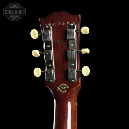 Gibson guitar headstock with brand logo on a black background