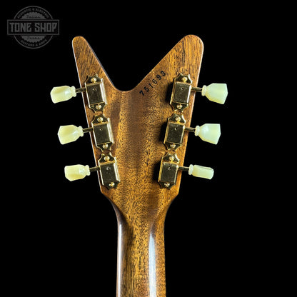 Close-up of a guitar headstock with 'Tone Shop' logo in the corner.